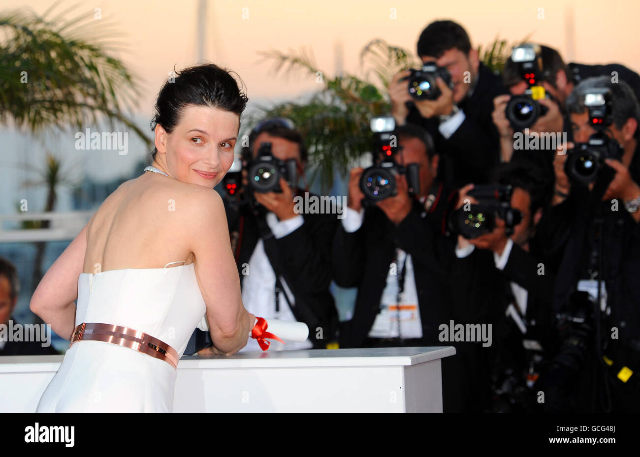 Juliette Binoche with her award for best performance by an actress for her role in Certified Copy at the 63rd Cannes Film Festival, France. Stock Photo