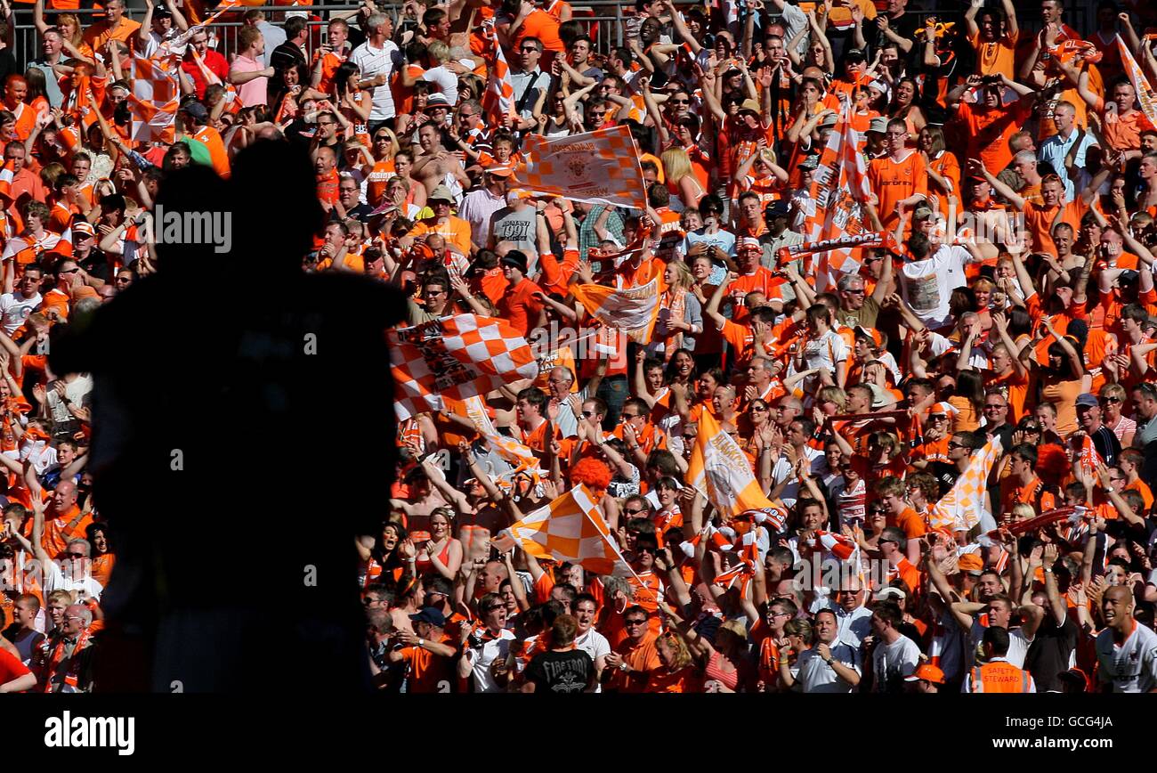 Blackpool players celebrate infront of blackpool fans in the stands hi