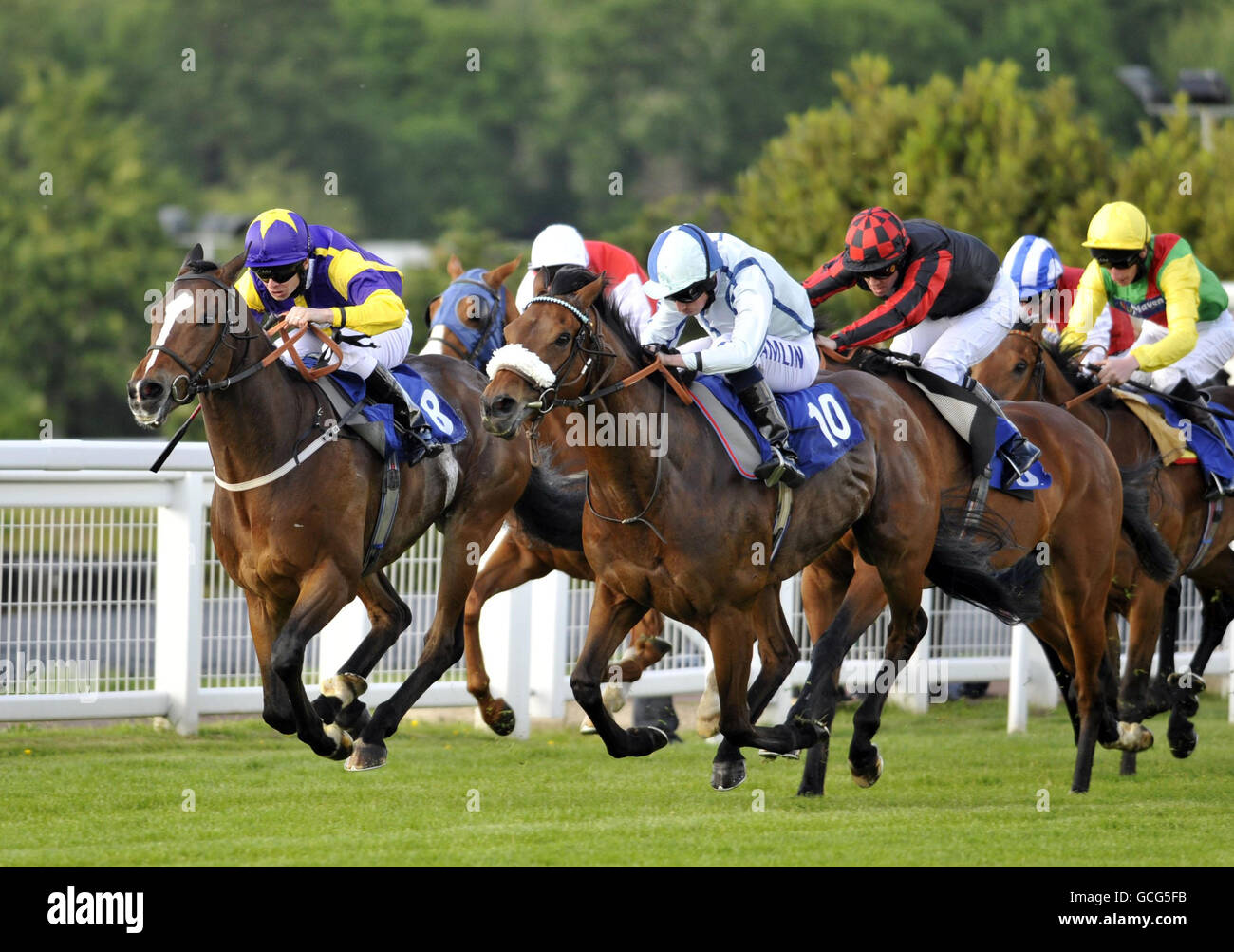 Jo'Burg (number10) ridden by Ryan Moore wins The Bluesq.com On Your iphone Handicap Stakes at Sandown Racecourse, Sandown. Stock Photo