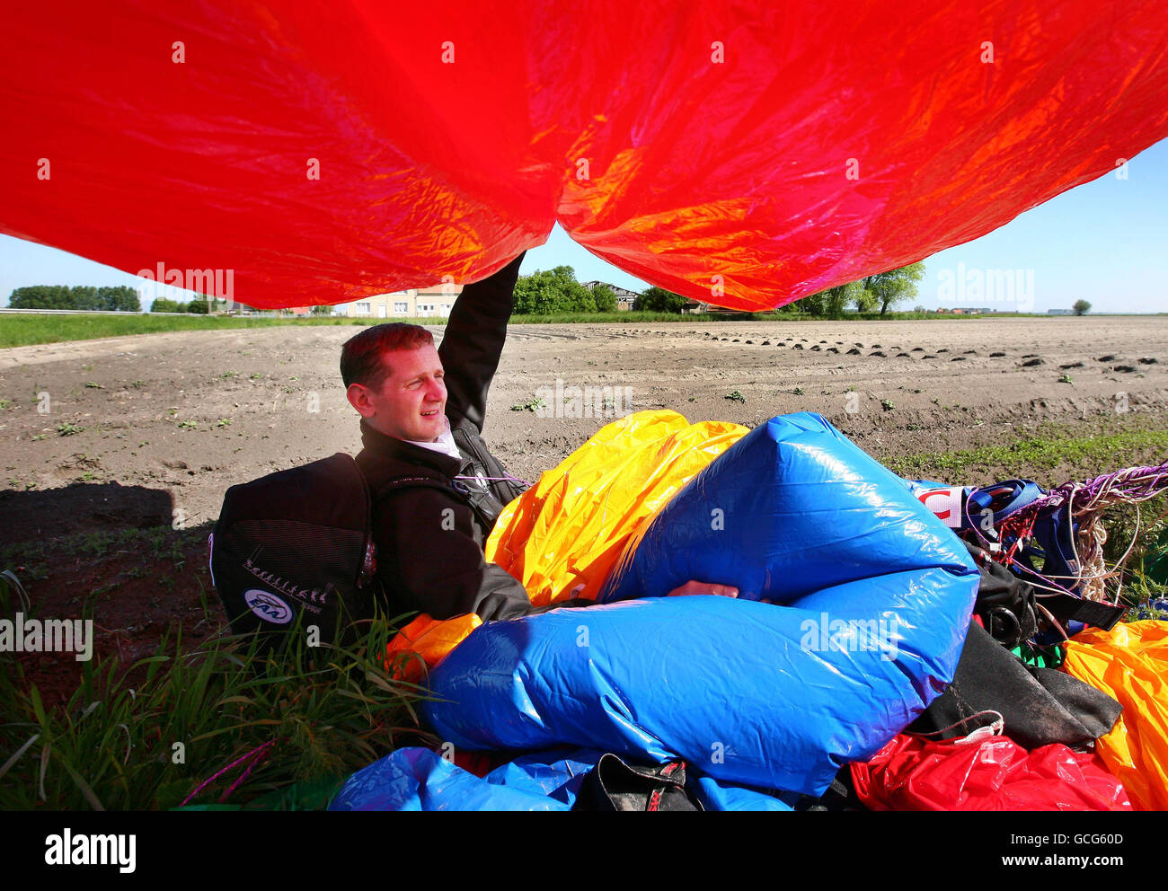 Jonathan Trappe with his balloon after landing on farmland in Moeres