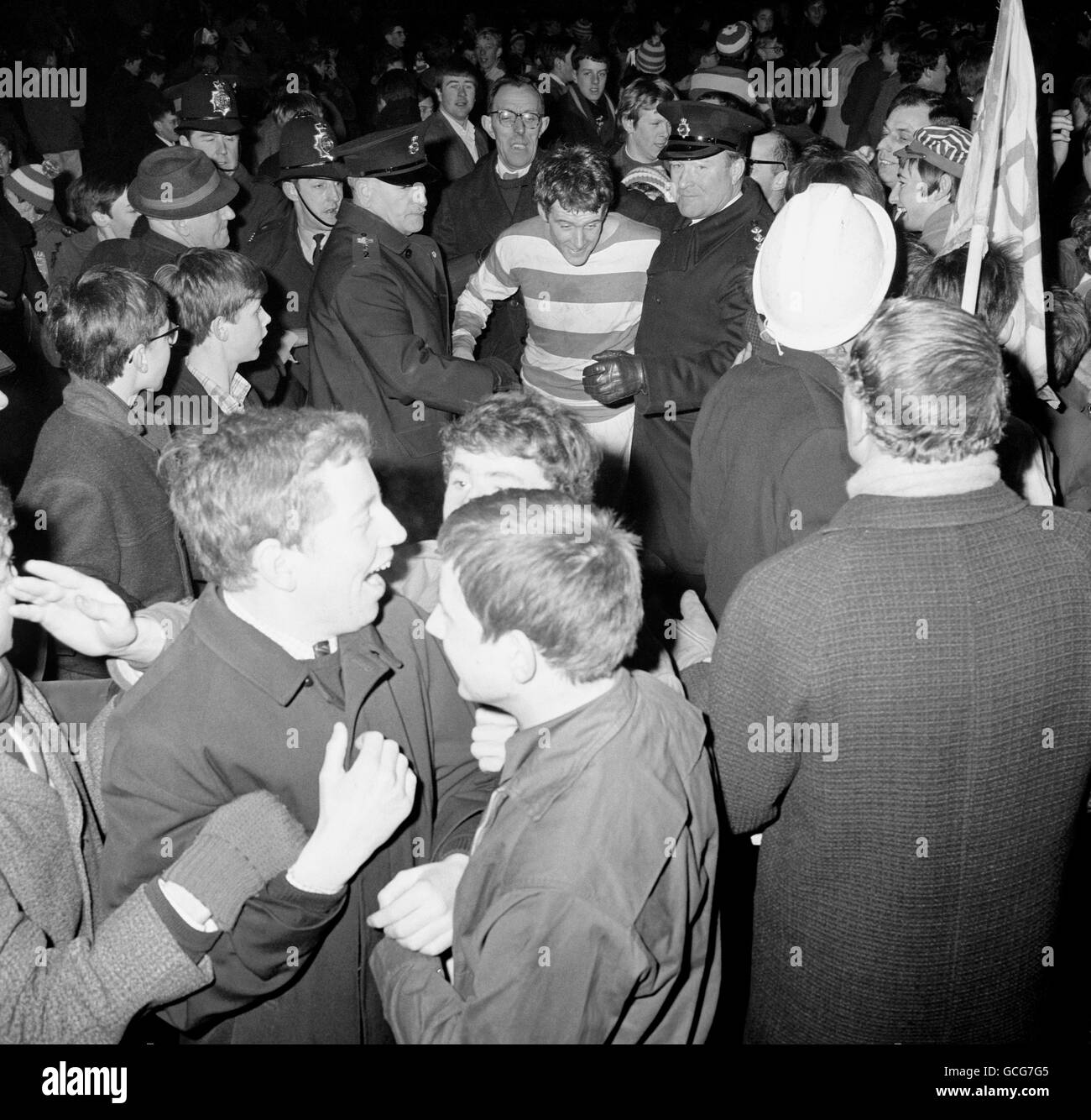 Soccer - League Cup - Semi-Final - Second Leg - Queens Park Rangers v Birmingham City - Loftus Road. Rodney Marsh, of Queens Park Rangers, is mobbed by fans after his goals sealed a 3-1 win and a ticket to the League Cup final. Stock Photo