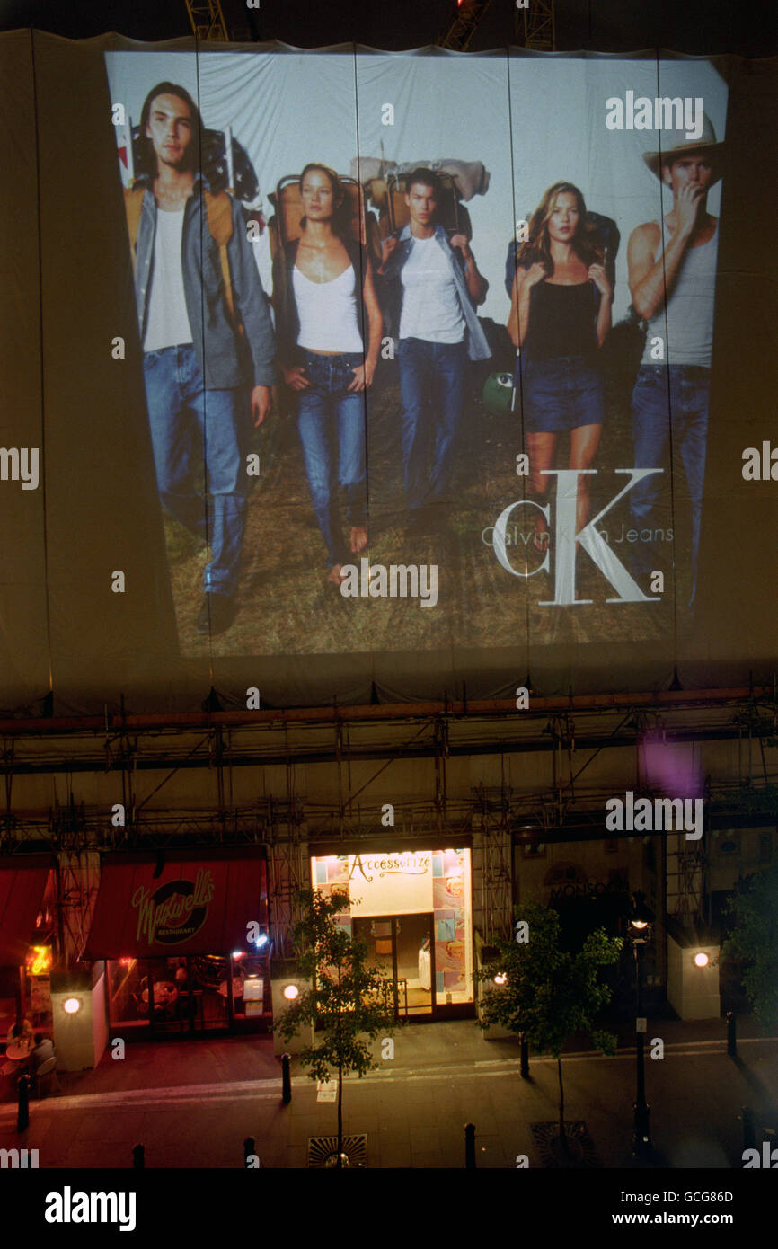 THE FASHION HOUSE CALVIN KLEIN LAUNCH THEIR NEW ADVERTISING CAMPAIGN BY  PROJECTING IMAGES OF THEIR MODELS WEARING THEIR JEANS ON THE SIDE OF THE  ROYAL OPERA HOUSE IN LONDON'S COVENT GARDEN WHICH
