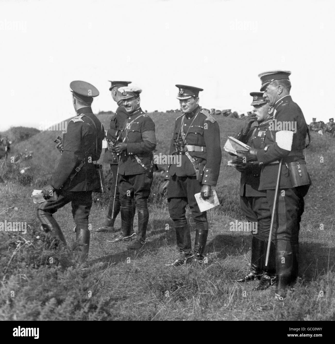 Home Secretary Winston Churchill, third right, watching manoeuvres at Aldershot with General French, second right. Stock Photo
