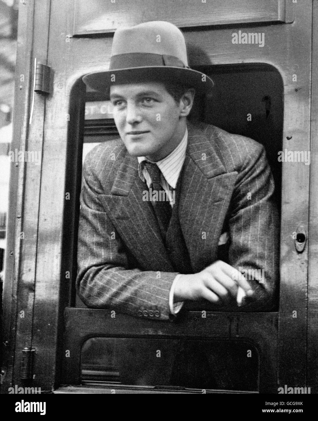 Randolph Churchill, the son of Winston Churchill, at Waterloo Station before leaving for America. Stock Photo