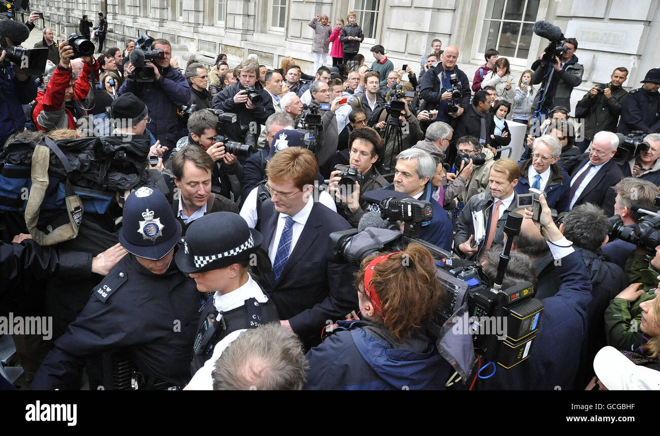 (left to right) Danny Alexander, Chris Huhne and David Laws leaves the Cabinet Offices on Whitehall in London after a meeting with the Conservative Party negotiation team. Stock Photo