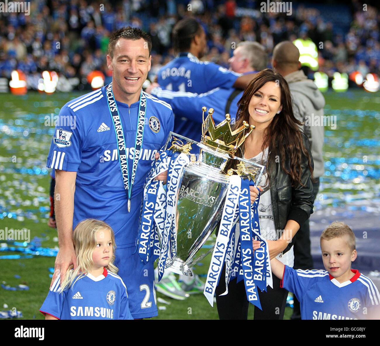 Chelsea captain John Terry with wife Toni Poole and their two children celebrate with the Premier League trophy Stock Photo