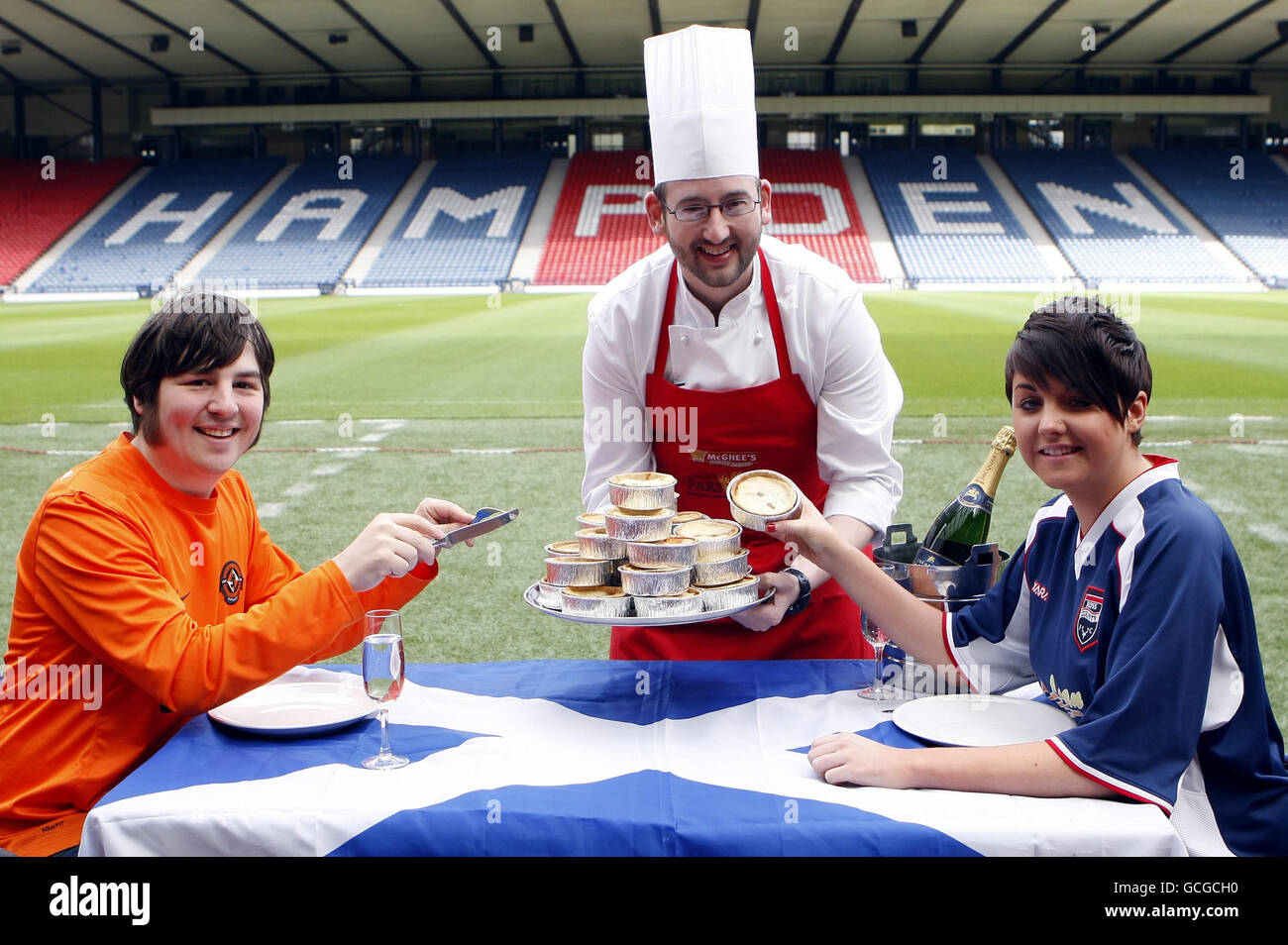 Ross County fan Leanne Bonner (right), Dundee United fan Jamie Kidd (left) and chef Glen Yorke with the new 40% reduced fat Scotch Pie at Hampden in Glasgow to be sold at the Scottish FA Cup final on Saturday. Stock Photo