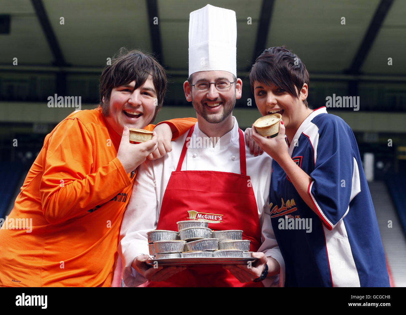 Ross County fan Leanne Bonner (right), Dundee United fan Jamie Kidd (left) and chef Glen Yorke with the new 40% reduced fat Scotch Pie at Hampden in Glasgow to be sold at the Scottish FA Cup final on Saturday. Stock Photo