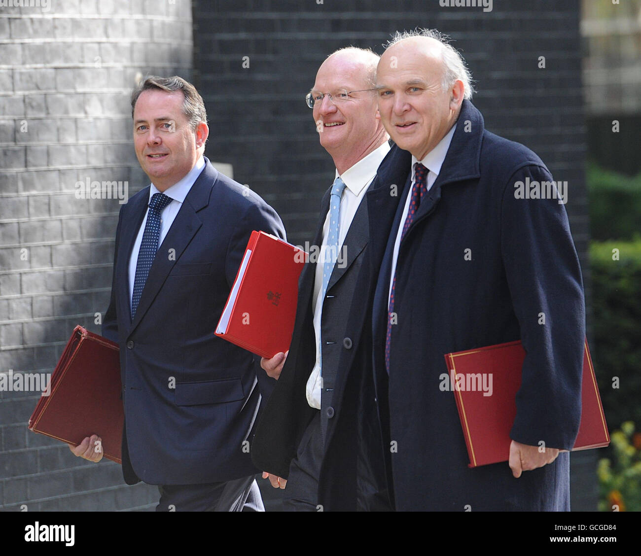 Defence Secretary Liam Fox (left), Minister of State (Universities and Science) - Department for Business, Innovation and Skills David Willetts (centre) and Business, Innovation and Skills Secretary Vince Cable arrive at 10 Downing Street for the first Cabinet meeting of the new coalition government. Stock Photo