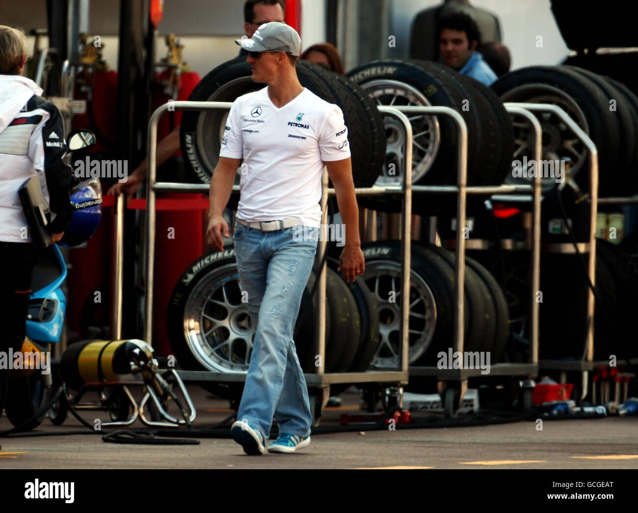 Mercedes' Michael Schumacher makes his way down the pit lane after the