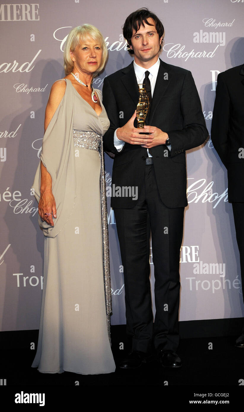 Dame Helen Mirren, wearing Chopard jewellery, presents the 2010 Chopard Trophy for the best newcomer actor to Edward Hogg, on the second day of the Cannes Film Festival, France. Stock Photo