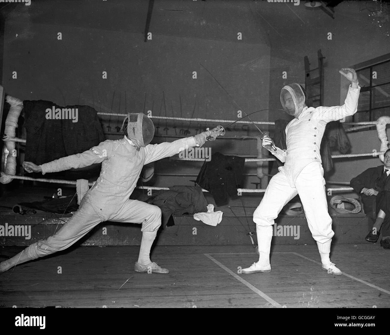 Fencing competition at Guys hospital - Edinburgh, Cambridge and London University.. L to R: MRF Gunningham (Cambridge) and JM Brudenall (London) in an Epee dual. Stock Photo