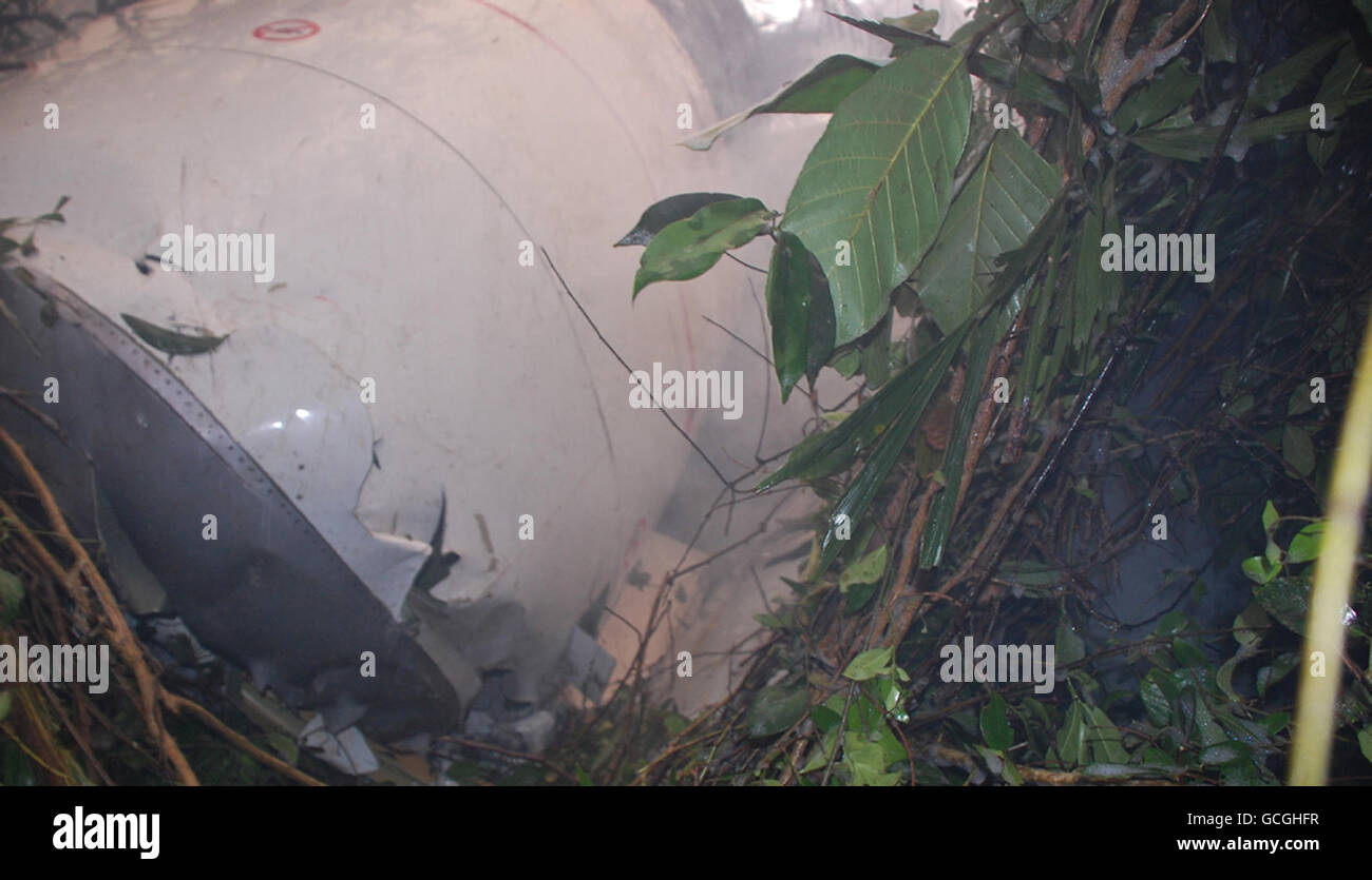 Parts of the broken up plane near to the scene in Mangalore were around 160 people were feared dead in an Air India plane crash at the airport in southern India. Stock Photo