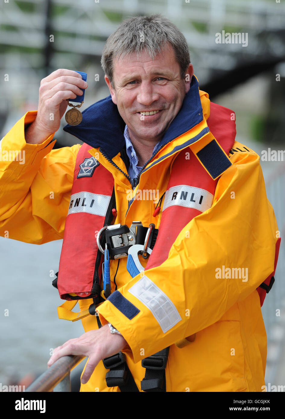 Anthony Chambers, a crew member of Portrush lifeboat station is awarded the Royal National Lifeboat Institution's Bronze medal for Gallantry for rescuing two 14 year old boys trapped in a cave near Castlerock Strand on 5 August 2009. Stock Photo