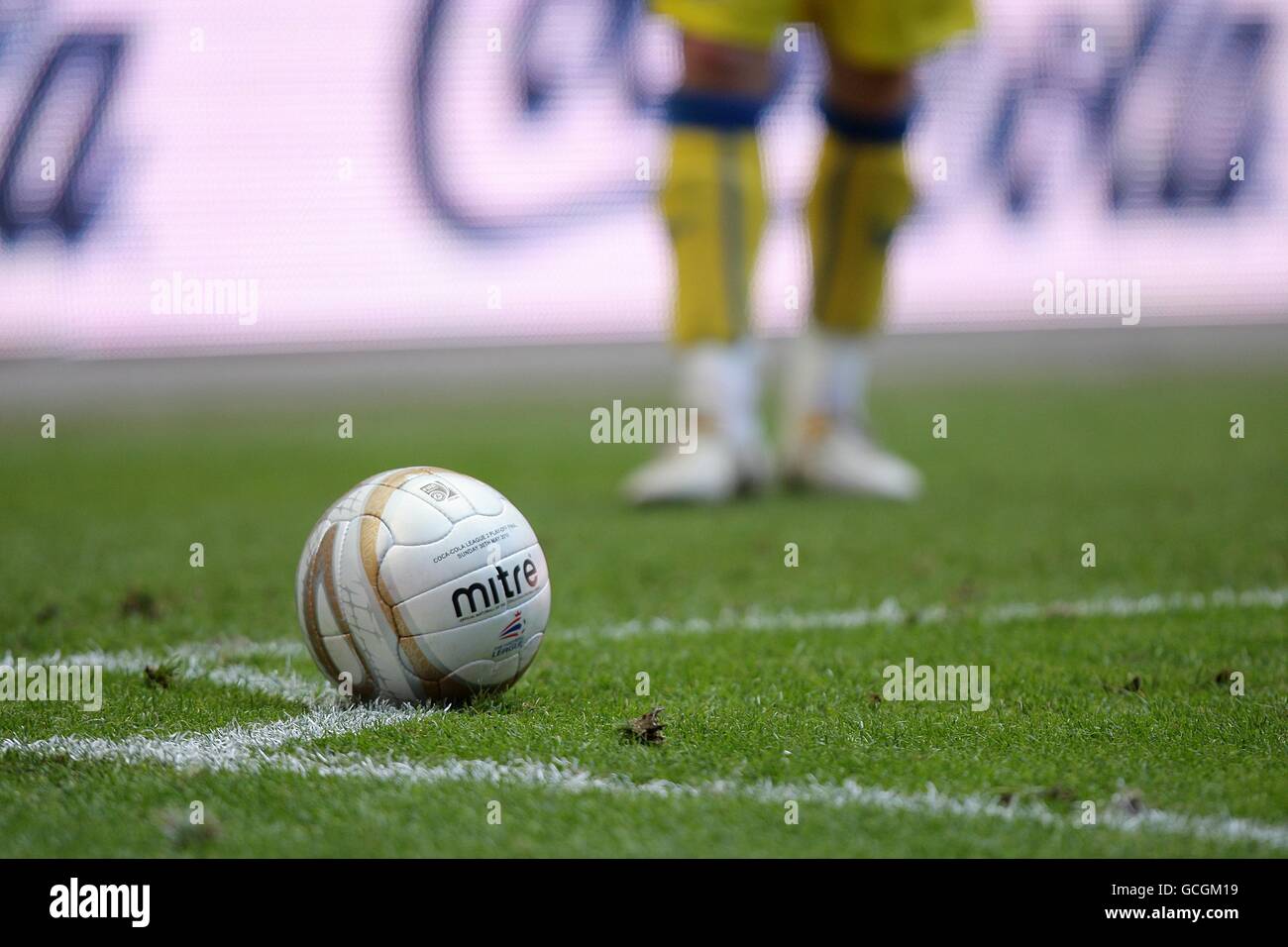 Detail of the match ball on the pitch, prior to a corner kick Stock Photo