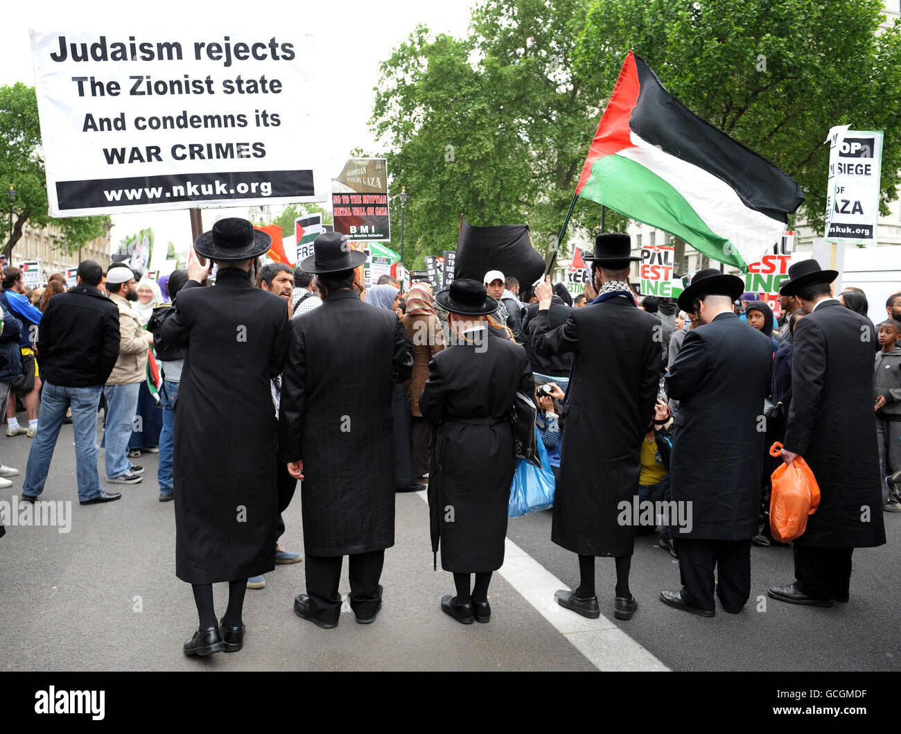 Hasidic Jews, a group who traditionally do not agree with Israel's action against Palestine, join pro-Palestianian campaigners in Whitehall, London after up to 15 people were reportedly killed after Israeli commandoes boarded ships carrying aid to Gaza. Stock Photo