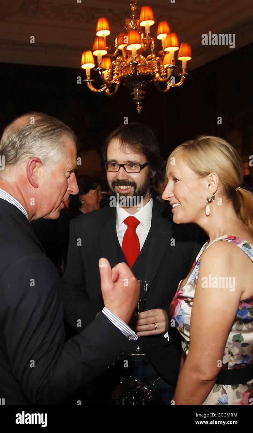 The Prince of Wales, known as the Duke of Rothesay in Scotland, meets Harry Potter author J K Rowling (right) and her husband Dr Neil Murray (centre) during a reception for The Scottish Traditional Skills Training Centre at the Palace of Holyroodhouse in Edinburgh. Stock Photo