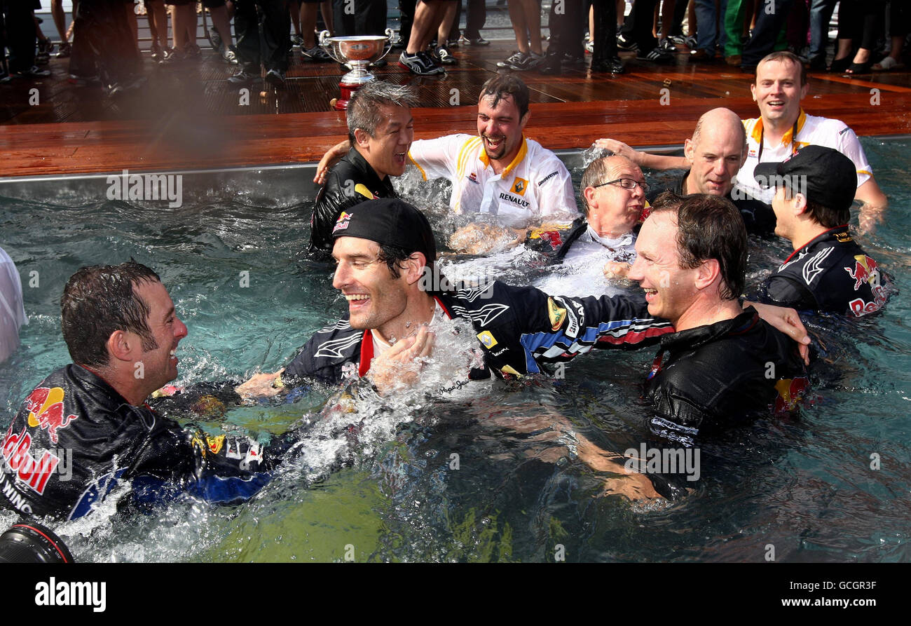 Mark Webber (second left) celebrates his victory with Bull mates in the pool the Red Bull Energy Station during the Grand Prix at the Circuit de Monaco, Monte