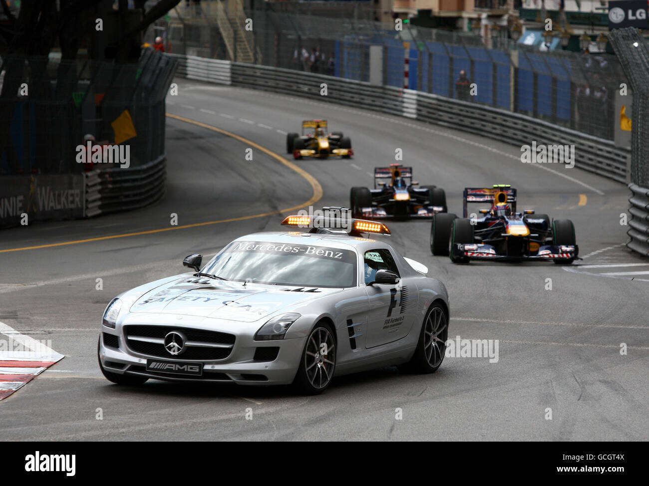 The 2010 Mercedes-Benz SLS AMG F1 Safety Car leads Red Bull driver Mark Webber and the rest of the drivers around the circuit during the Monaco Grand Prix at the Circuit de Monaco, Monte Carlo. Stock Photo