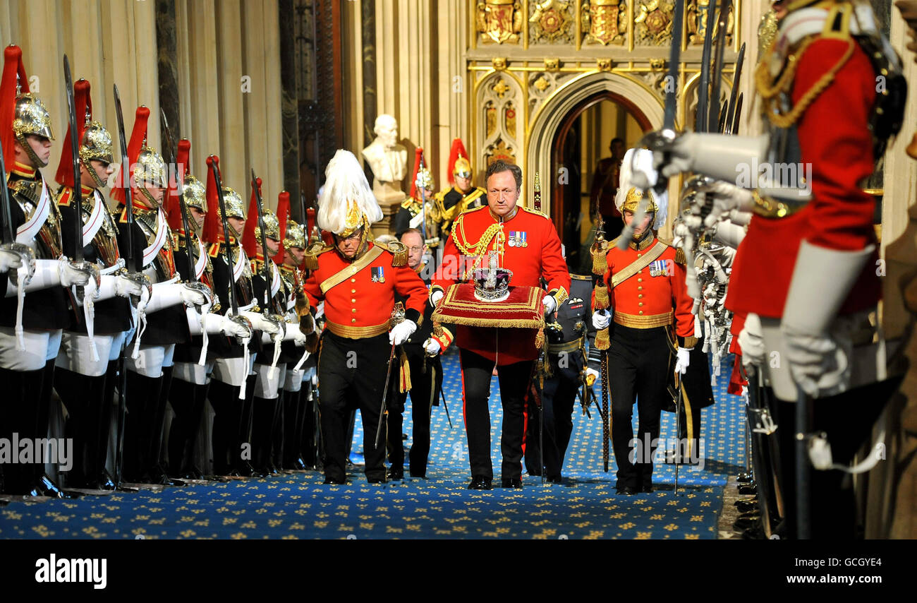 The Imperial State Crown is transported up the Norman stairs, in the Houses of Parliament, before the State Opening of Parliament in London. Stock Photo