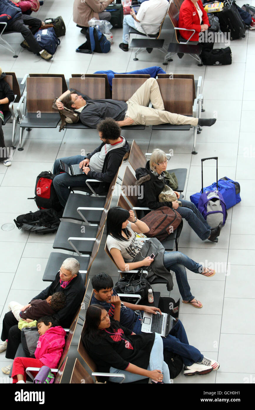 Air passengers wait for flights at Heathrow's Terminal 5, during the May bank holiday at London Heathrow. Stock Photo