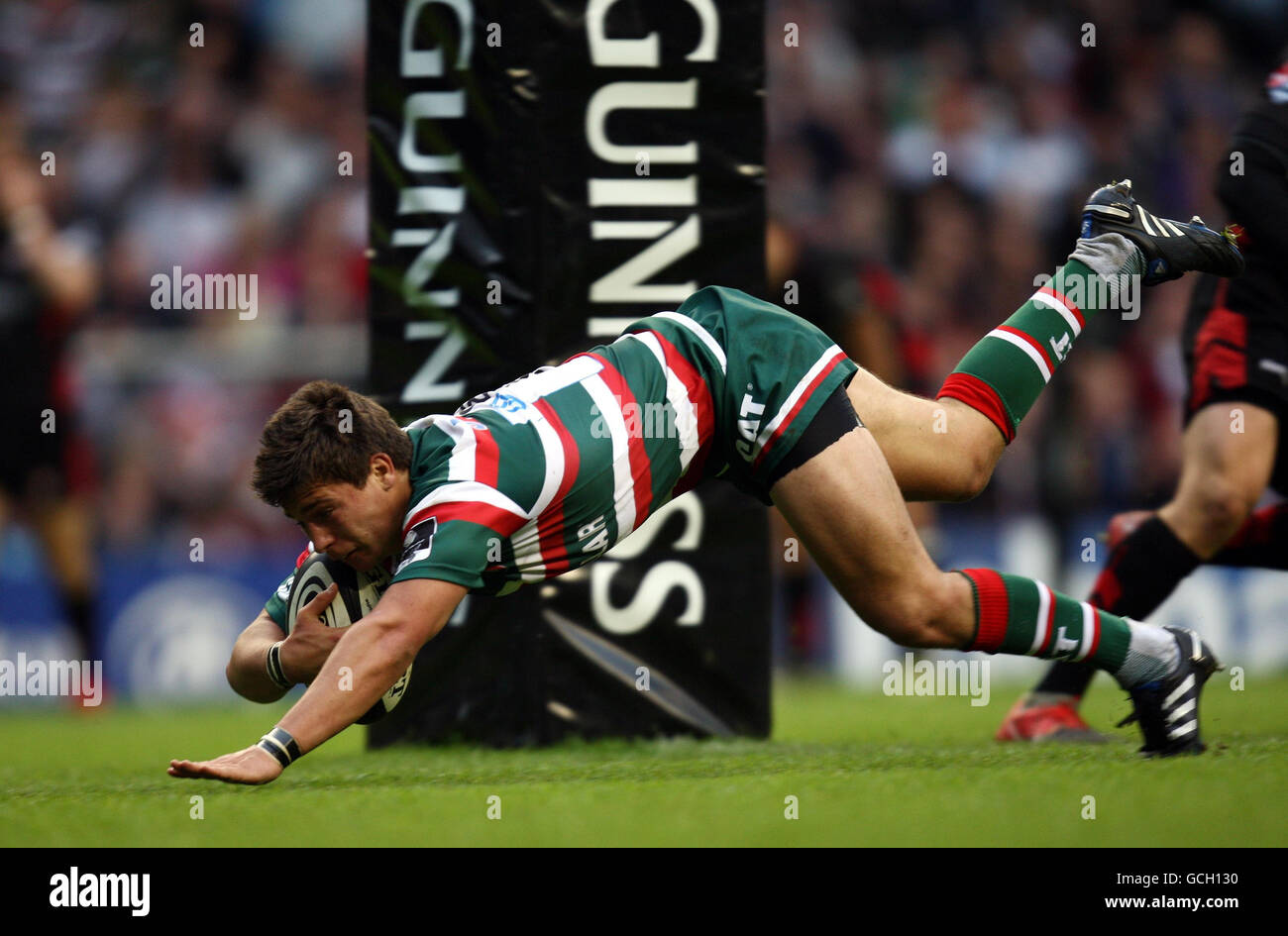 Rugbyu guinness action scoring ball pitch mangms hires stock