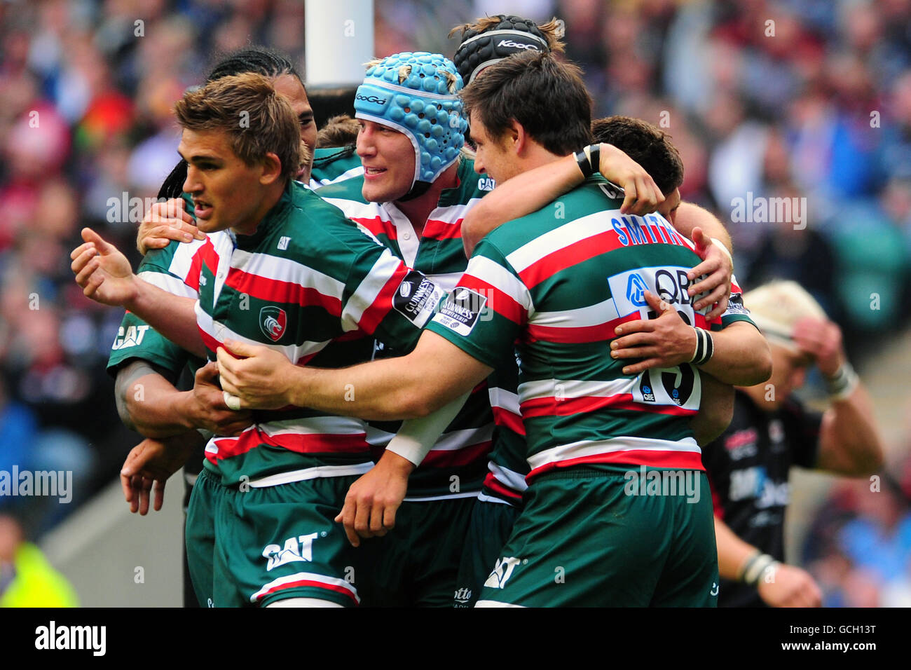 Leicester Tigers' Matt Smith celebrates his try with Ben Youngs and ...