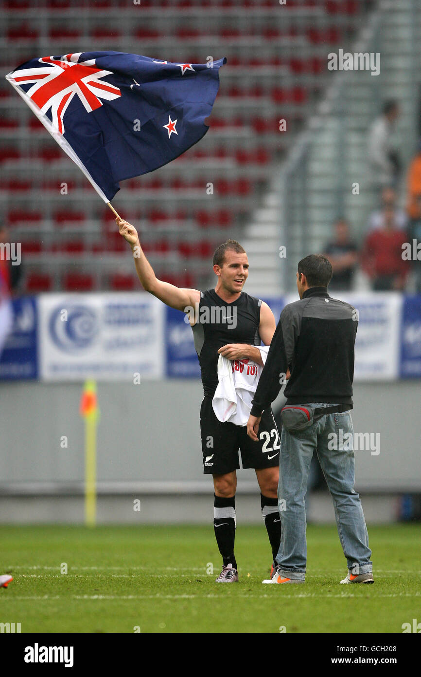 Soccer - International Friendly - New Zealand v Serbia - Wortherseestadion. New Zealand's Jeremy Brockie waves his National flag after victory over Serbia Stock Photo