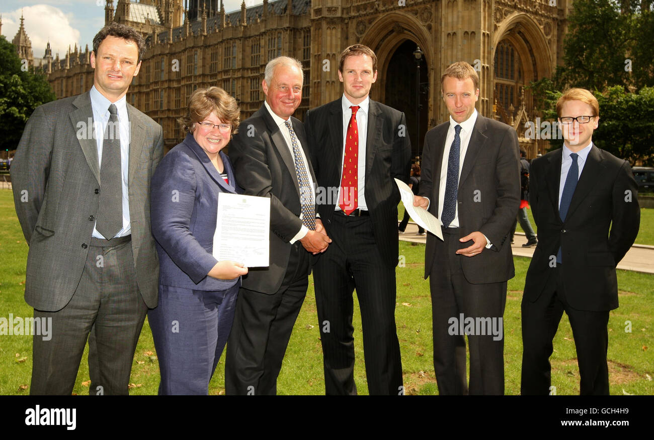 Suffolk MPs (left to right) MP for Waveney Peter Aldous, MP for Suffolk Coastal Therese Coffey, MP for South Suffolk Tim Yeo, MP for Central Suffolk and North Ipswich Dr Dan Poulter, MP for West Suffolk Matthew Hancock, and MP for Ipswich Ben Gummer, who are calling for the restoration of a fair funding formula for the county on issues such as health, education and transport, outside the Houses of Parliament, Westminster, London. Stock Photo