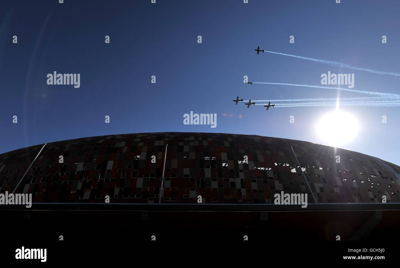 Stunt planes fly over The Soccer City Stadium in Johannesburg, South Africa during rehearsals for the World Cup opening ceremony. Stock Photo