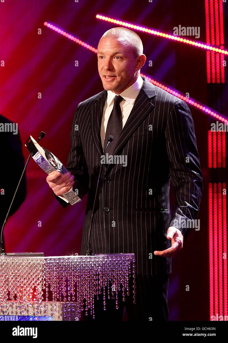 Guy Ritchie on stage to collect the Best Action/Thriller award for Sherlock Holmes at the 2010 National Movie Awards at the Royal Festival Hall, London. Stock Photo
