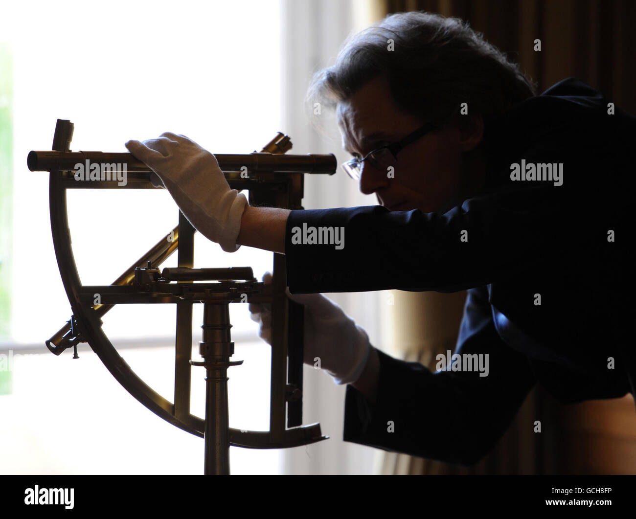 Royal Society librarian Keith Moore examines an astronomical quadrant ...