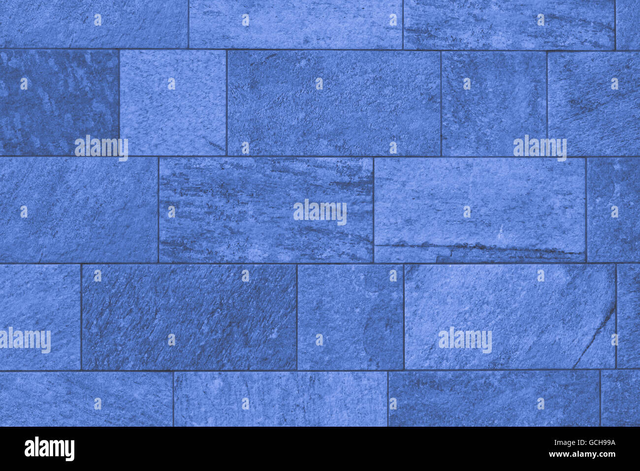 A Wall Of Indigo Blue Bricks With White Top Stock Photo Alamy