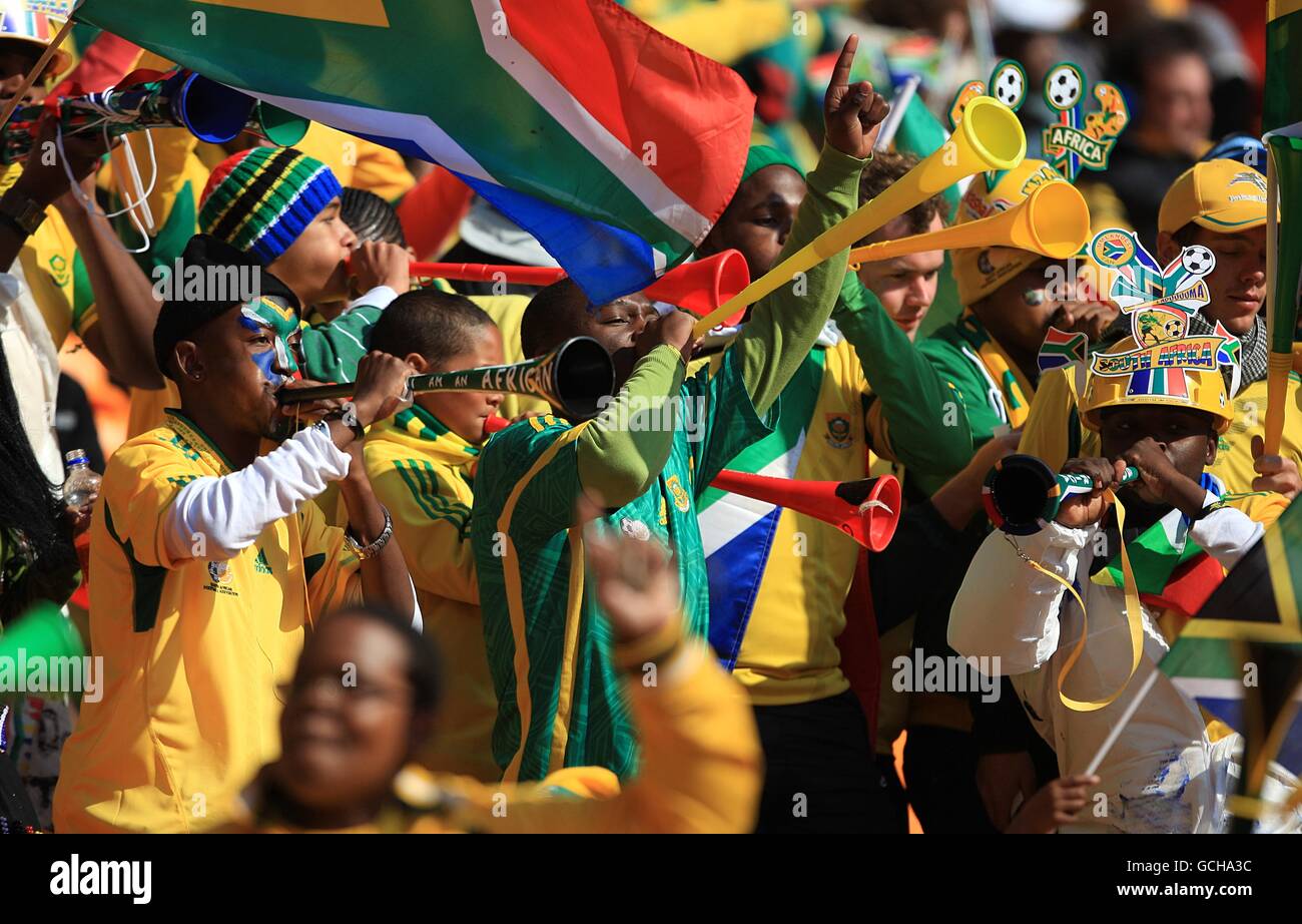 Soccer - 2010 FIFA World Cup South Africa - Opening Ceremony - Soccer City Stadium. South Africa fans blow Vuvuzelas inside the Soccer City Stadium prior to the Opening Ceremony Stock Photo