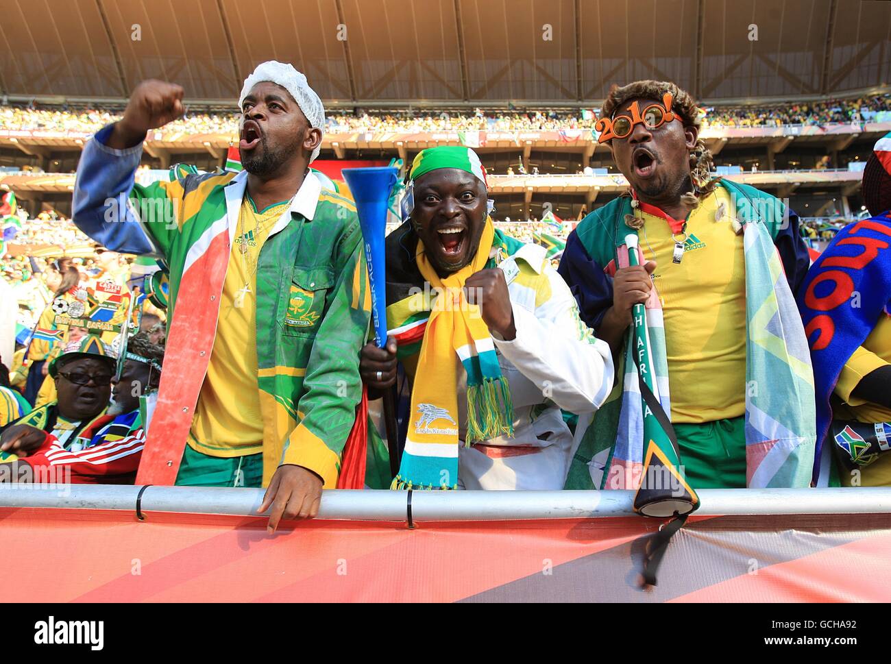 Soccer - 2010 FIFA World Cup South Africa - Group A - South Africa v Mexico - Soccer City Stadium. South Africa fans cheer on their side in the stands prior to kick off Stock Photo