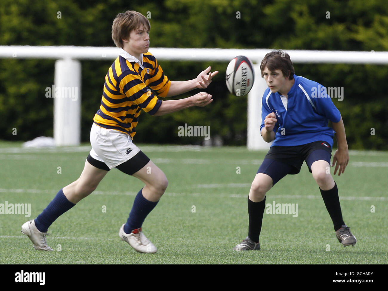 General match action between Portobello (in stripes) and St Augustine's compete during the Edinburgh Schools 7s Finals Day at Murrayfield Back Pitches, Edinburgh. Stock Photo