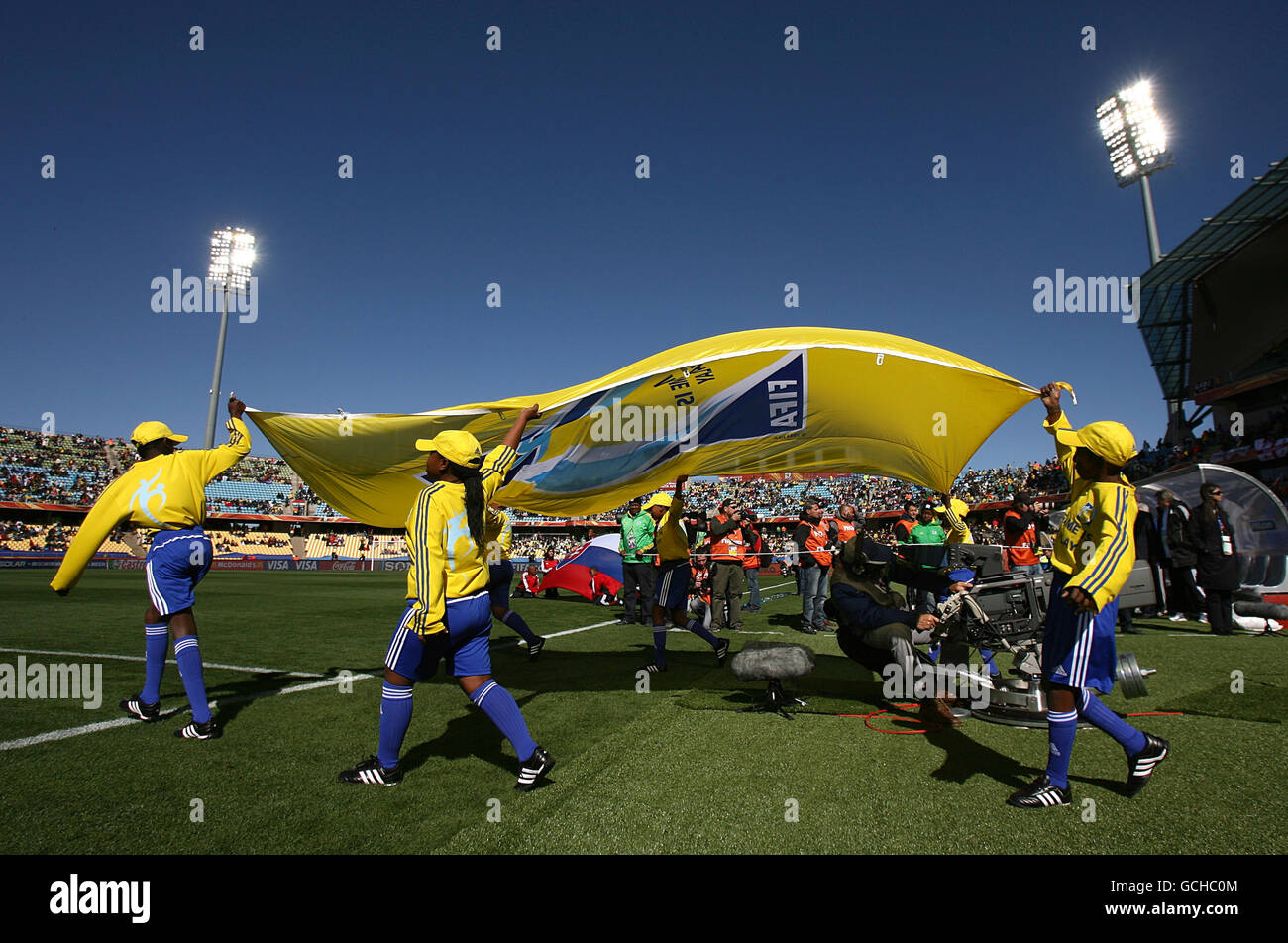 Soccer - 2010 FIFA World Cup South Africa - Group F - New Zealand v Slovakia - Royal Bafokeng Stadium. Mascots walk out with a flag prior to kick off Stock Photo