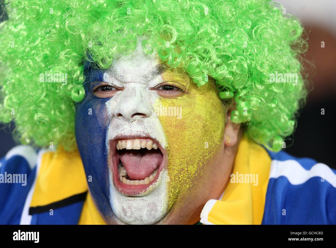 A Brazilian fan shows her support, in the stands prior to kick off Stock Photo