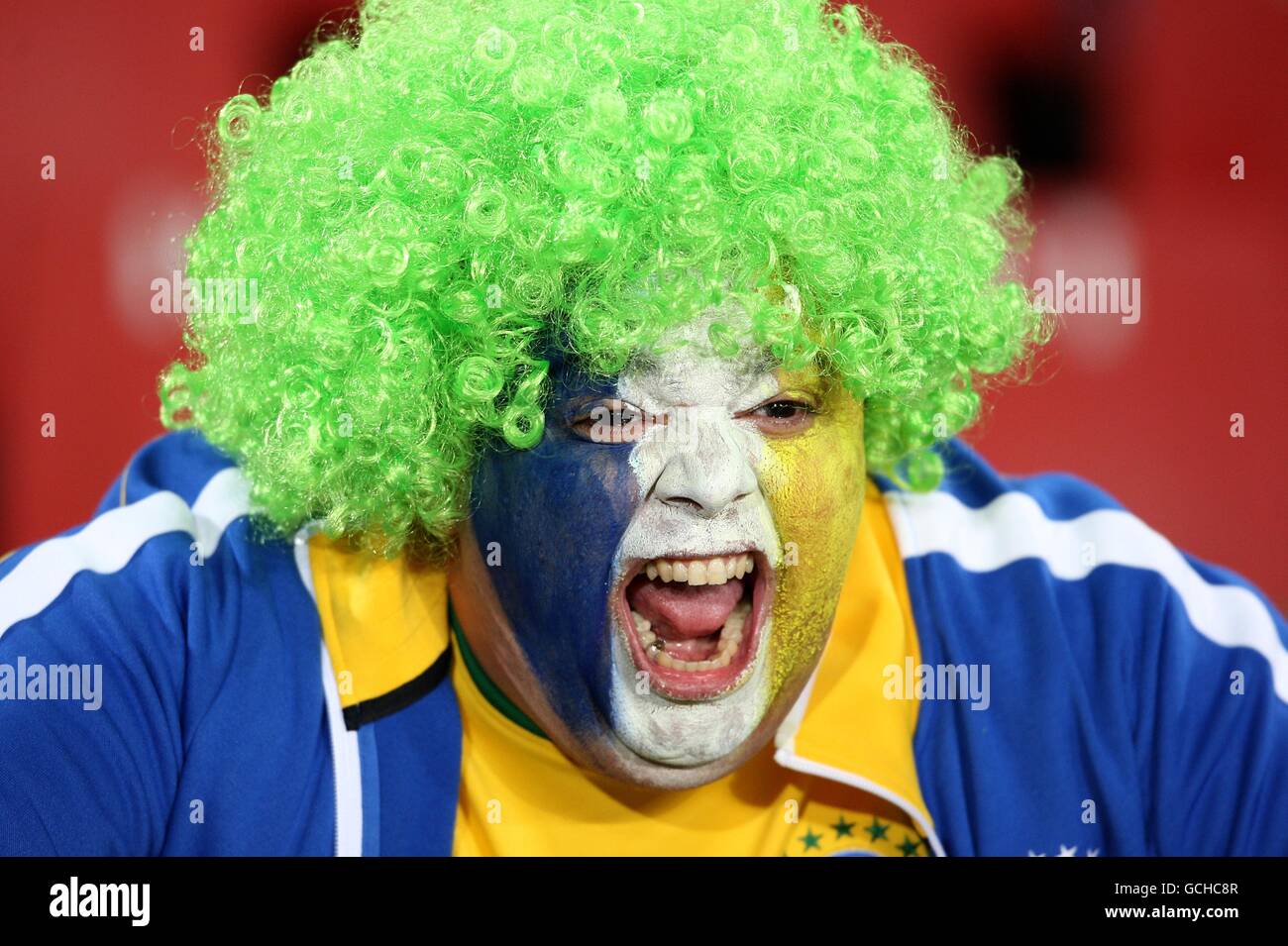A Brazilian fan shows her support, in the stands prior to kick off Stock Photo