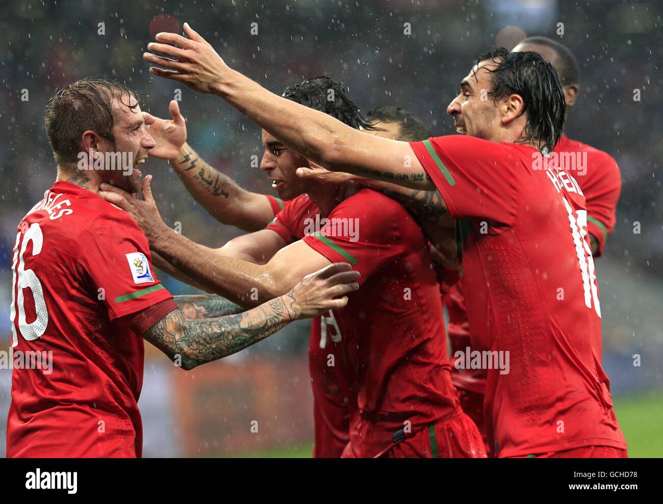 Portugal's Jose Raul Meireles (left) celebrates scoring the opening goal of the game with his teammates Stock Photo