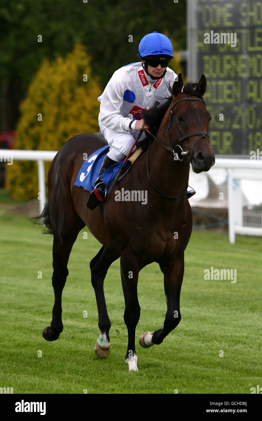 Horse Racing - Salisbury Racecourse. Valeo Si Vales ridden by jockey Fergus Sweeney going to post prior to The 'Come Shopping At Castlepoint' Bournemouth Maiden Auction Stakes Stock Photo
