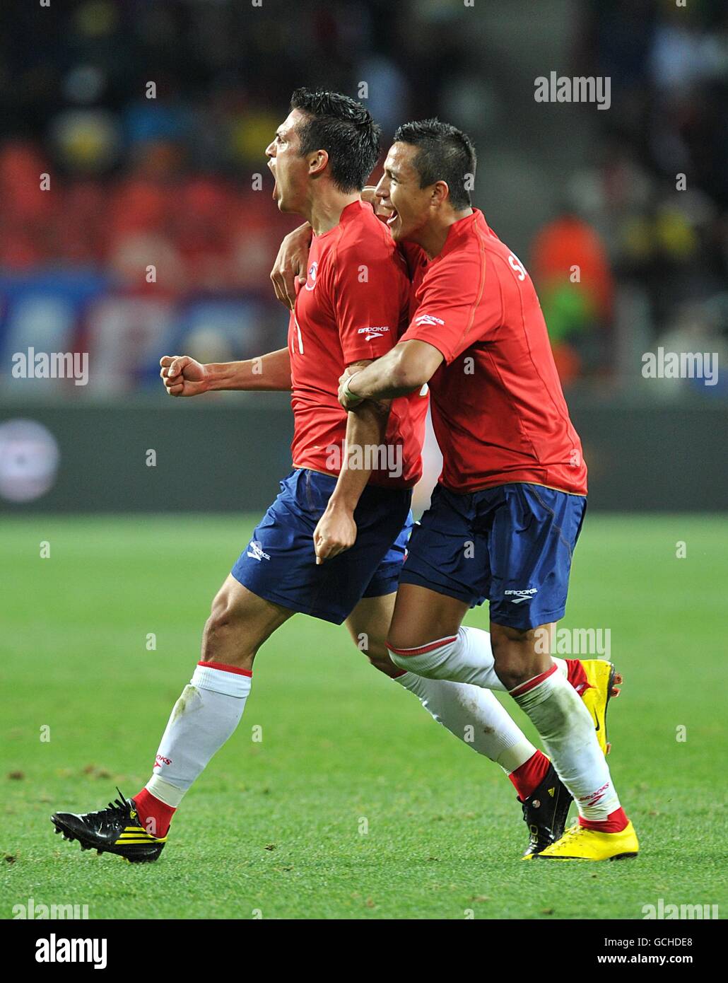 Chile's Mark Gonzalez celebrates scoring his sides opening goal of the game with Alexis Sanchez (right) Stock Photo