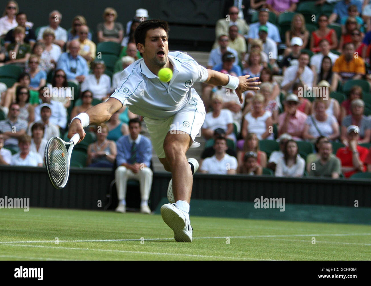 Novak djokovic hitting ball hi-res stock photography and images - Alamy