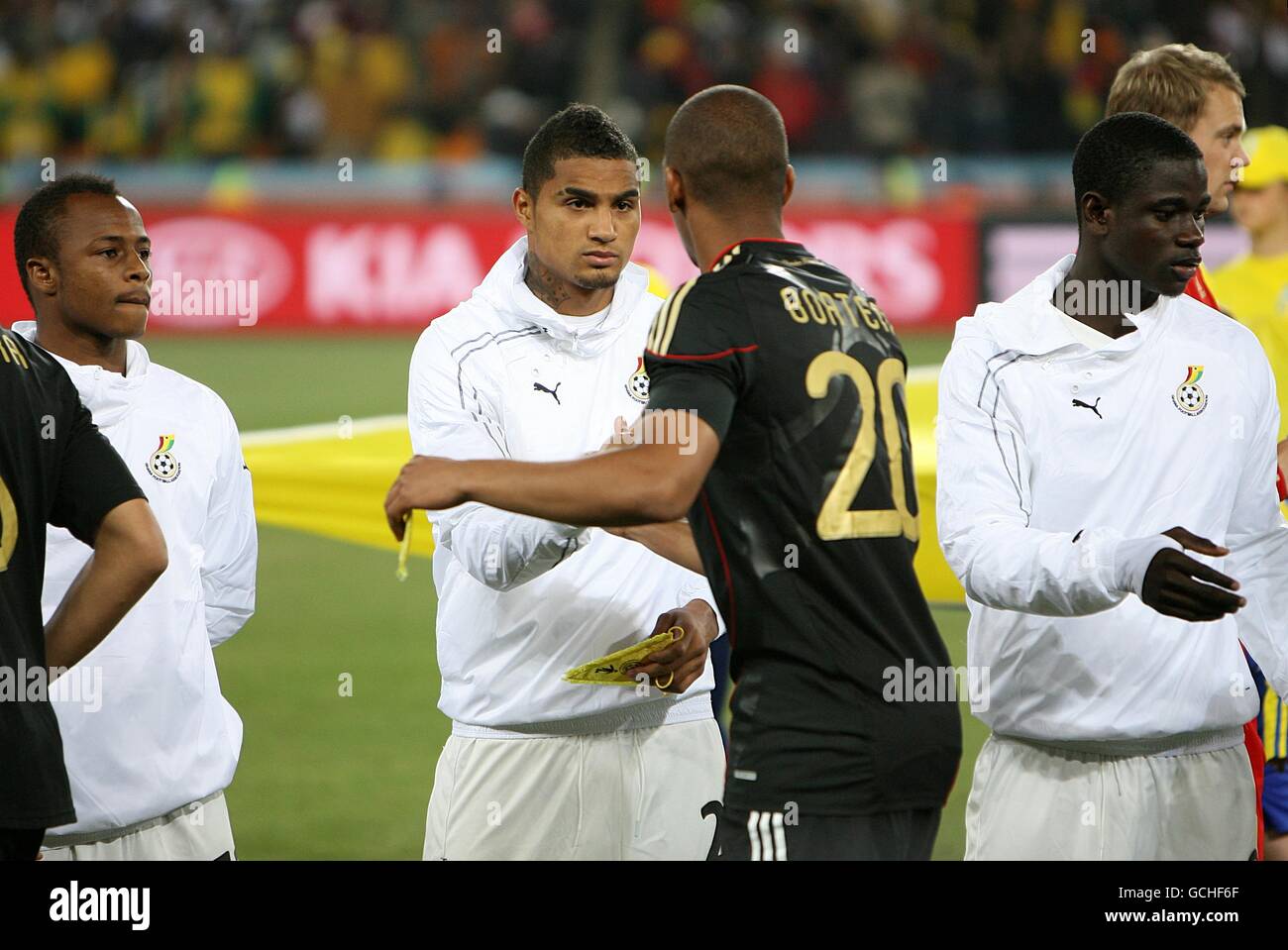 Germany's Jerome Boateng (centre right) and Ghana's Kevin-Prince Boateng shake hands before kick off Stock Photo
