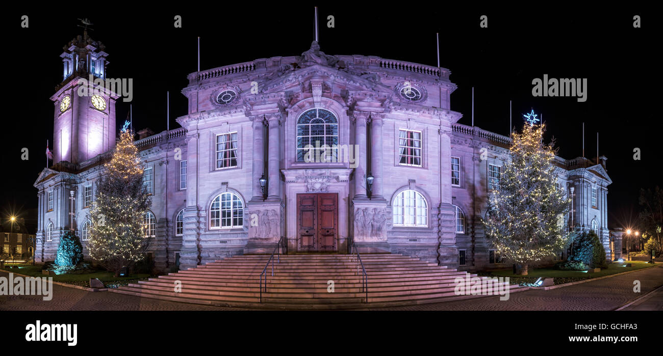 Town Hall illuminated at nighttime and decorated for Christmas; South