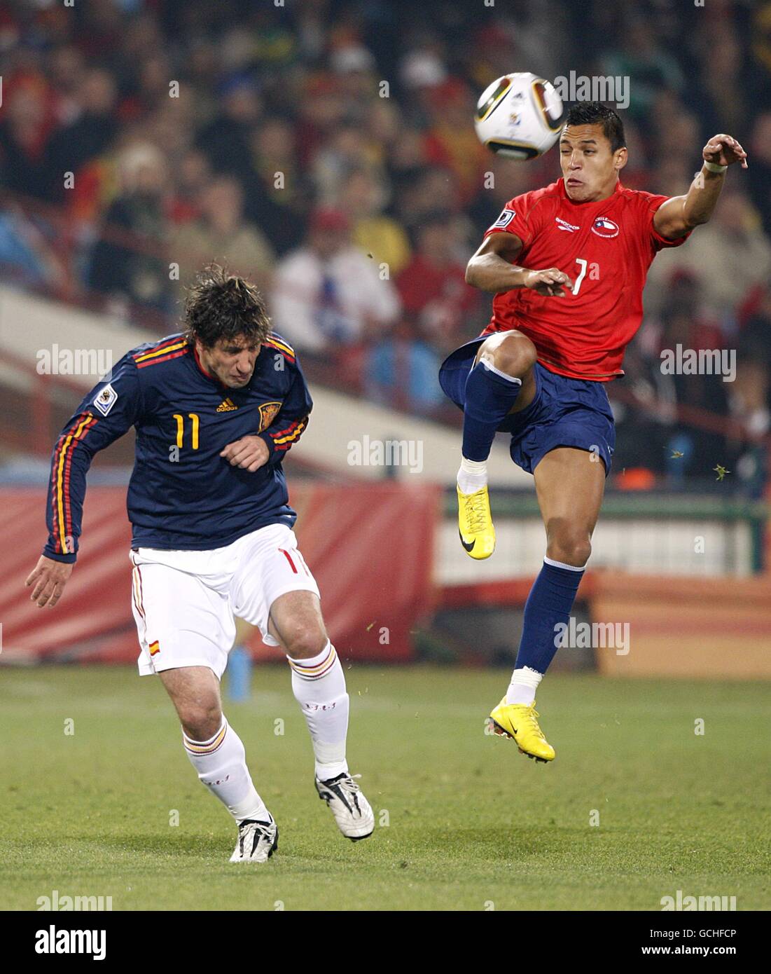 Chile's Alexis Sanchez (right) and Spain's Joan Capdevila (left) battle for the ball Stock Photo