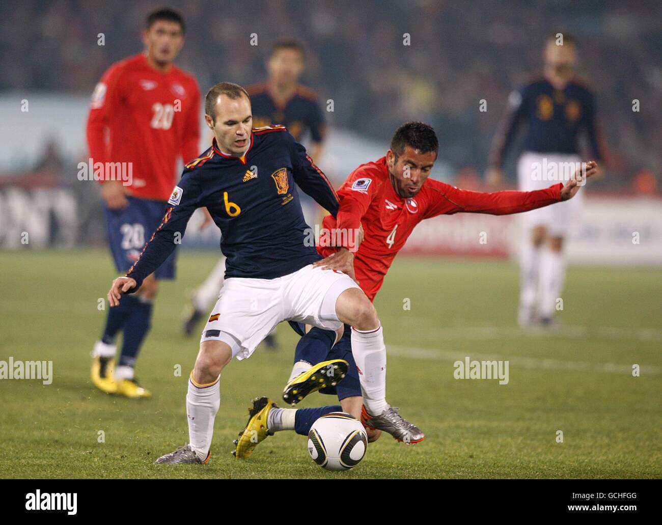Chile's Mauricio Isla (right) and Spain's Andres Iniesta (left) battle for the ball Stock Photo