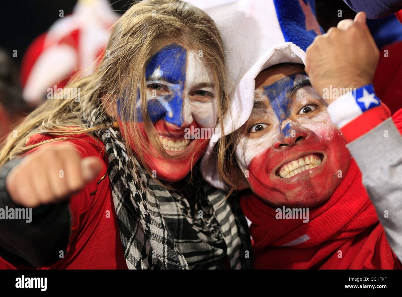 Chile fans celebrate in the stands after progressing to the next round Stock Photo