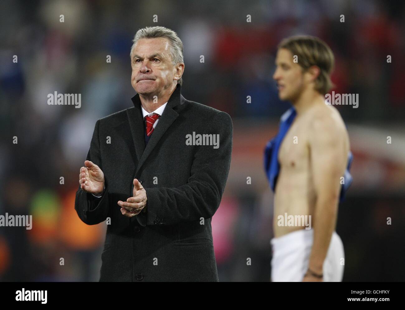 Soccer - 2010 FIFA World Cup South Africa - Group H - Switzerland v Honduras - Free State Stadium. Switzerland's Head Coach Ottmar Hitzfeld (left) thanks their fans for their support after the final whistle. Stock Photo