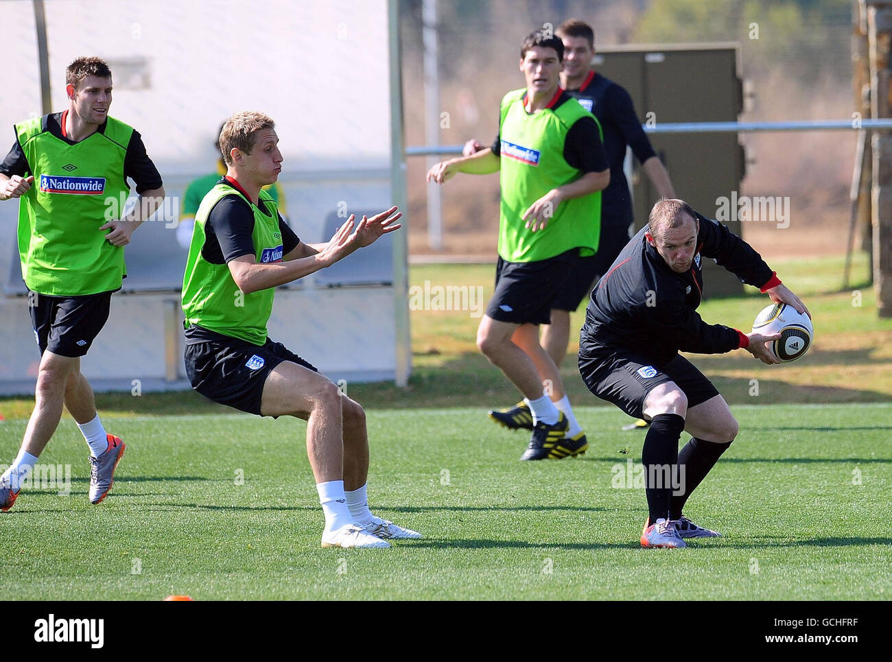 Soccer - 2010 FIFA World Cup South Africa - Round of 16 - Germany v England - England Training Session - Day Two - Royal Bafo.... England's Wayne Rooney (right) and Micahel Dawson during a training session at the Royal Bafokeng Sports Complex, Rustenburg, South Africa. Stock Photo